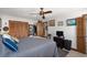 Cozy bedroom with comfortable looking bed, a ceiling fan, and wood accents at 6813 Porcher Dr. # 25, Myrtle Beach, SC 29572