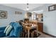 Cozy dining area adjacent to kitchen with a wood table and seating for six at 6813 Porcher Dr. # 25, Myrtle Beach, SC 29572