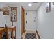 Hallway features a light blue wall, tiled floors, and decorative wall hangings and decorations at 6813 Porcher Dr. # 25, Myrtle Beach, SC 29572