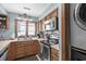 Well-lit kitchen with stainless steel appliances and classic wood cabinetry at 6813 Porcher Dr. # 25, Myrtle Beach, SC 29572
