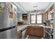 Bright kitchen featuring stainless steel appliances and wood cabinets at 6813 Porcher Dr. # 25, Myrtle Beach, SC 29572