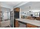 Open kitchen with stainless steel dishwasher and views to the dining and living areas at 6813 Porcher Dr. # 25, Myrtle Beach, SC 29572