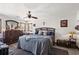 Bright main bedroom featuring neutral walls, ceiling fan, and a decorative dresser at 6813 Porcher Dr. # 25, Myrtle Beach, SC 29572