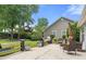 Serene backyard with a patio, seating, and lush greenery, ideal for relaxation at 6887 King Arthur Dr., Myrtle Beach, SC 29588