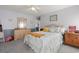 Cozy bedroom with a comfortable bed, wooden dresser, and soft lighting, creating a relaxing retreat at 6887 King Arthur Dr., Myrtle Beach, SC 29588