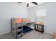 Bedroom with a gray bunk bed, neutral walls, and a small side table, ideal for a room at 6887 King Arthur Dr., Myrtle Beach, SC 29588