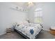 Bright bedroom with a large window, soft blue walls, and a cozy bed with decorative accents at 6887 King Arthur Dr., Myrtle Beach, SC 29588
