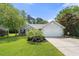 Charming single-story home with brick accents, two car garage, and lush landscaping at 6887 King Arthur Dr., Myrtle Beach, SC 29588