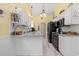 Modern kitchen with stainless steel appliances, granite countertops, and white cabinets at 6887 King Arthur Dr., Myrtle Beach, SC 29588