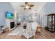 Bright living room with vaulted ceilings, hardwood floors, fireplace, and views of the backyard at 6887 King Arthur Dr., Myrtle Beach, SC 29588