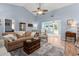 Spacious living room with vaulted ceilings, hardwood floors, and comfortable neutral-toned furnishings at 6887 King Arthur Dr., Myrtle Beach, SC 29588