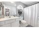 Bright bathroom with neutral color scheme and decorative shelves at 7007 Blade Beak Ln., Myrtle Beach, SC 29588