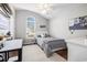 Childs bedroom featuring a modern bed frame, white trim, a desk and hardwood floors at 7007 Blade Beak Ln., Myrtle Beach, SC 29588