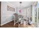 Dining room featuring a wood table, cushioned chairs and updated pendant lighting at 7007 Blade Beak Ln., Myrtle Beach, SC 29588