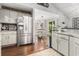 Bright kitchen featuring stainless steel refrigerator, granite countertops and eat-in kitchen at 7007 Blade Beak Ln., Myrtle Beach, SC 29588