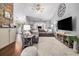 Spacious living room featuring a large sectional sofa, contemporary decor, and plenty of natural light at 7007 Blade Beak Ln., Myrtle Beach, SC 29588
