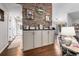 Bright living room featuring a stone accent wall, built-in cabinets, and an open layout for entertaining at 7007 Blade Beak Ln., Myrtle Beach, SC 29588