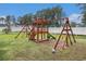 Community playground with swings, slide, and climbing structure for outdoor fun and recreation at 7007 Blade Beak Ln., Myrtle Beach, SC 29588