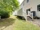 Backyard view showcasing fenced property line, patio, and lawn at 702 Beach Walk Pl. # 702, Myrtle Beach, SC 29577
