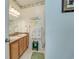 Bathroom featuring double sinks, granite counters, and vanity with plenty of cabinet space at 702 Beach Walk Pl. # 702, Myrtle Beach, SC 29577