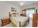 Bedroom with ceiling fan, carpeted floor, and traditional furniture at 702 Beach Walk Pl. # 702, Myrtle Beach, SC 29577