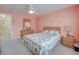 Comfortable bedroom features neutral carpeting, dresser, and stylish, shell-themed bedding at 702 Beach Walk Pl. # 702, Myrtle Beach, SC 29577