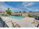 Enjoy the community pool surrounded by comfortable lounge chairs and well-maintained landscaping at 702 Beach Walk Pl. # 702, Myrtle Beach, SC 29577