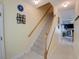 Inviting hallway with stairs, featuring neutral tones and decorative accents at 702 Beach Walk Pl. # 702, Myrtle Beach, SC 29577