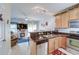 Cozy open kitchen with modern appliances and a breakfast bar overlooking the living area at 702 Beach Walk Pl. # 702, Myrtle Beach, SC 29577