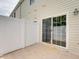 Cozy, fenced patio area adjacent to the home's sliding glass door entry at 702 Beach Walk Pl. # 702, Myrtle Beach, SC 29577