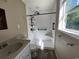 Bathroom featuring a modern vanity, tiled floors, and updated shower at 76 Lyerly Rd., Hemingway, SC 29554