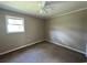 Bedroom featuring neutral walls, carpet, a ceiling fan, and a window at 76 Lyerly Rd., Hemingway, SC 29554