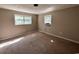 Bedroom featuring two windows, an AC unit, neutral walls, and carpet at 76 Lyerly Rd., Hemingway, SC 29554