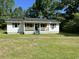 Charming single-story home featuring a well-maintained lawn and classic architectural details at 76 Lyerly Rd., Hemingway, SC 29554
