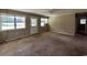 Bright living room with natural light, neutral walls and carpeted floors at 76 Lyerly Rd., Hemingway, SC 29554