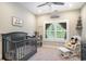 Charming Bedroom with a gray crib, playful decor, and ample natural light from the window at 769 Country Club Dr., Pawleys Island, SC 29585