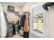 Walk-in closet with shelving, hanging space, and natural light streaming in through the window at 769 Country Club Dr., Pawleys Island, SC 29585