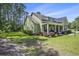 Inviting home exterior with manicured landscaping and a covered front porch at 769 Country Club Dr., Pawleys Island, SC 29585