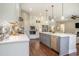 Well-appointed kitchen featuring a central island, ample counter space and stylish cabinets at 769 Country Club Dr., Pawleys Island, SC 29585
