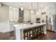 Modern kitchen with stainless steel appliances, a large island, and custom cabinetry at 769 Country Club Dr., Pawleys Island, SC 29585