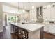 Bright kitchen with a large island, modern appliances, and stylish pendant lighting at 769 Country Club Dr., Pawleys Island, SC 29585