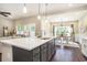 Bright, open kitchen with quartz countertops, stainless steel sink, and views of the dining and living areas at 769 Country Club Dr., Pawleys Island, SC 29585