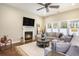 Comfortable living room with fireplace and lots of natural light from the windows at 769 Country Club Dr., Pawleys Island, SC 29585