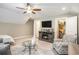 Inviting living room with a fireplace, TV, ceiling fan, and comfortable seating arrangement at 769 Country Club Dr., Pawleys Island, SC 29585