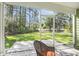 View from the screened porch out to pond and wooded backyard at 769 Country Club Dr., Pawleys Island, SC 29585