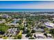 Aerial view of a community featuring a mix of residential homes, ponds, and lush greenery at 86 Wickham Ct., Pawleys Island, SC 29585