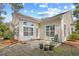 Backyard patio with a green Adirondack chair and potted plants at 86 Wickham Ct., Pawleys Island, SC 29585