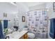 Bathroom with light blue paint and wood accents with shower and bath combination at 86 Wickham Ct., Pawleys Island, SC 29585