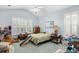 Bedroom featuring a ceiling fan, shutters, and ample storage space at 86 Wickham Ct., Pawleys Island, SC 29585