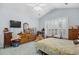 This charming bedroom features vaulted ceilings, shuttered windows, and a cozy, inviting atmosphere at 86 Wickham Ct., Pawleys Island, SC 29585